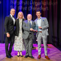 Desmoid tumor patient presenter Jon Fields and Dr. Jim Cassidy, CMO of SpringWorks Therapeutics, with host Peter Alexander and NORD CEO Pamela Gavin