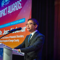 Dr. Richard Chang of Children’s Hospital of Orange County Metabolic Lab accepting Dr. Jose Abdenur’s Rare Impact Award on his behalf