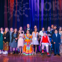 Kids and Teens with rare diseases on stage with host Peter Alexander