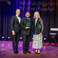 Rigo Garcia of the Hemophilia Foundation of Southern California with host Peter Alexander and NORD CEO Pamela Gavin