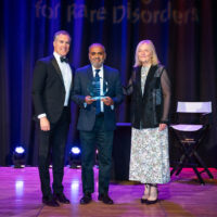 Award winner Irfan Patel of Delaware with host Peter Alexander and NORD CEO Pamela Gavin