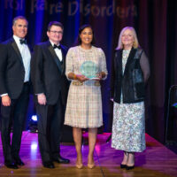 Tracey Meeks of Vertex Pharmaceuticals with host Peter Alexander, NORD’s Patrick Collins and CEO Pamela Gavin