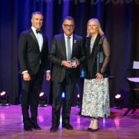 Past CEO of EURORDIS Yann Le Cam (center) with host Peter Alexander and NORD CEO Pamela Gavin