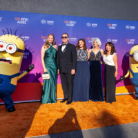 Guests posing with Minions Kevin and Stuart on the NORD orange carpet